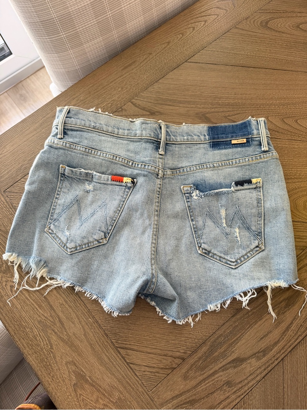 MOTHER Light Wash Distressed Denim Shorts with Colorful Pocket Trim - Picture 2 of 3